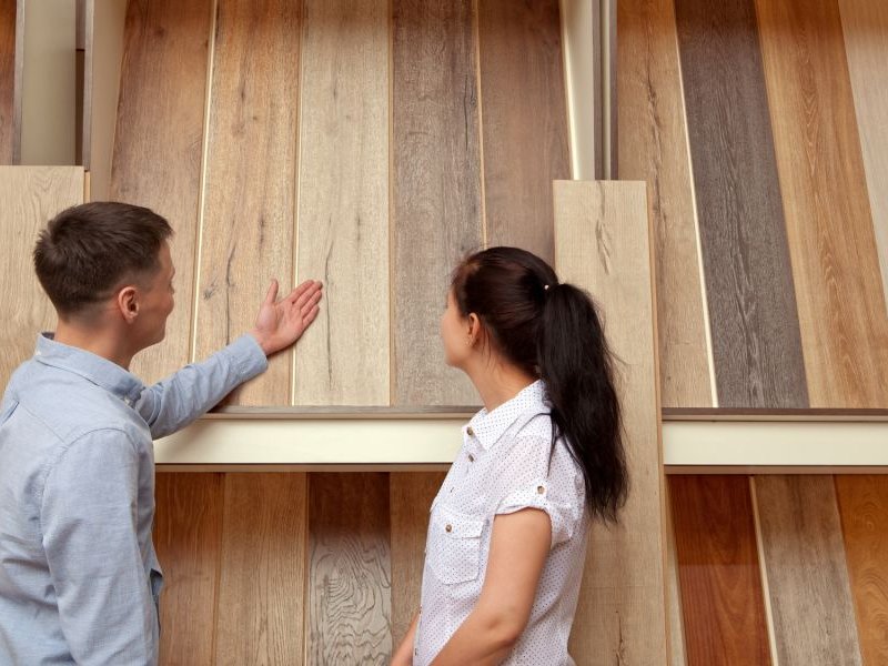 Customers examining floor products in-store